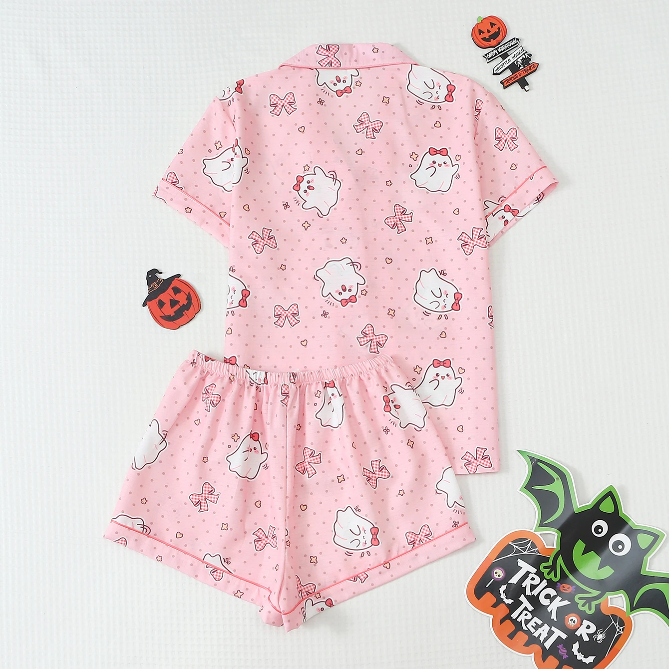2-piece set of quirky and fun Halloween-themed pajamas with polka dot and ghost print, featuring a bow and short-sleeved collared top with trim and bow shorts, suitable for women as home wear for Halloween