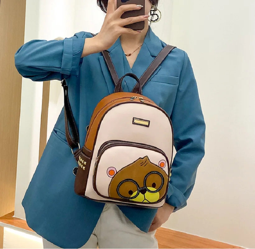

Hot Sale Women's New High Quality Leather Travel Backpacks Fashion Cartoon Bear Rivet Double Shoulder Bags Totes Crossbody Bag