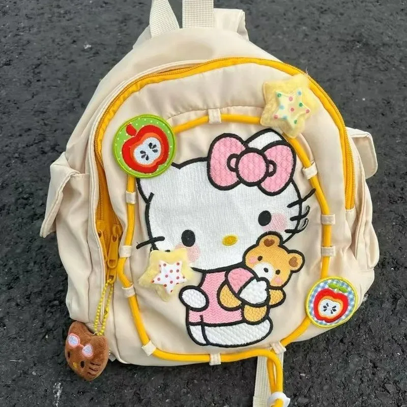 Mochila con estampado de Hello Kitty Sanrio, mochila para estudiantes a prueba de polvo, mochila de viaje multifuncional Simple, regalo de Navidad para niña