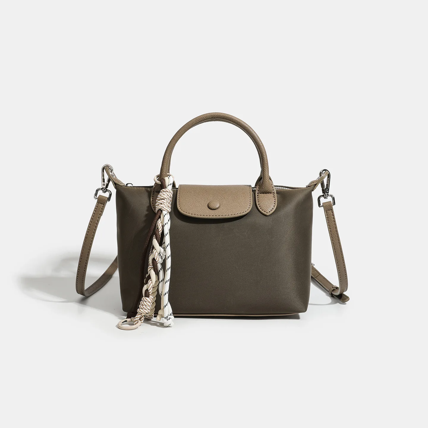 

The 2025 'Hobo' Mini. A chic, crescent-shaped bag for shoulder or crossbody wear this season.