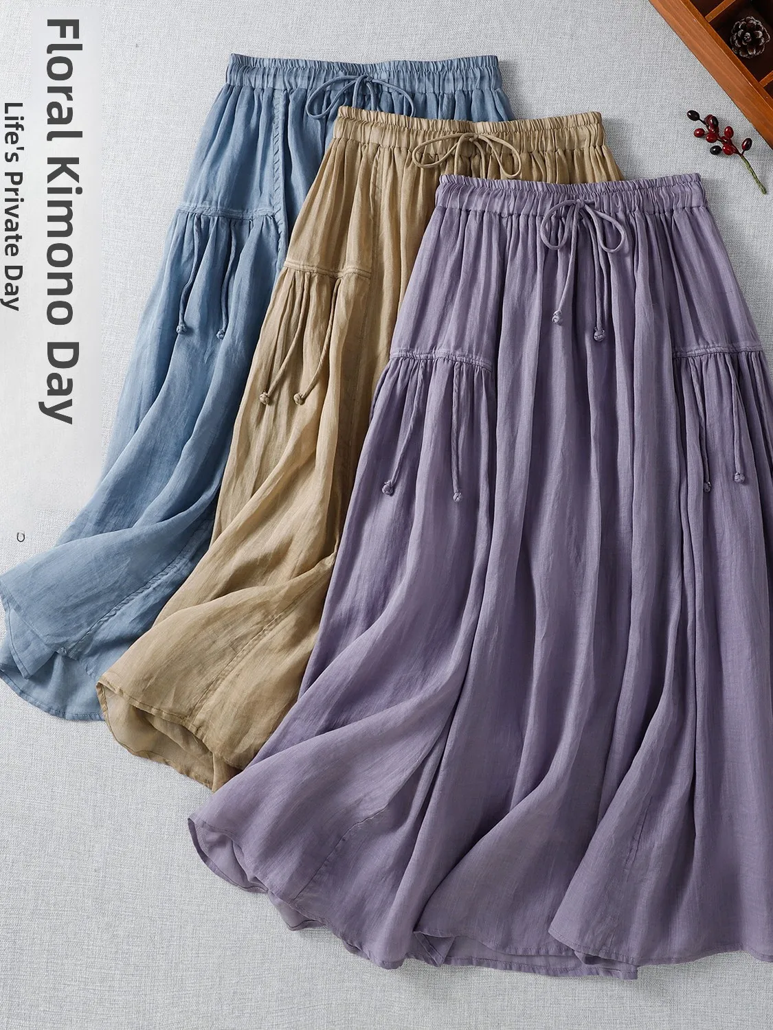 Ele عالية الخصر لون نقي ثنيات فضفاضة مرونة الخصر طويلة عادية ألف خط تنورة حجم كبير الصيف المرأة Faion التنانير