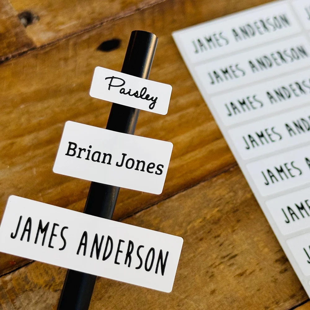 50 Uds. Pegatinas personalizadas con nombre blanco para niños, etiquetas para guardería y negocios, suministros escolares personalizados, fiambrera, botella de agua, impresión