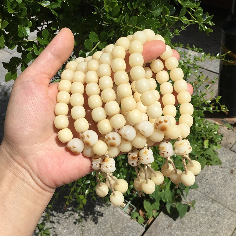 Creamy vintage barrel bead bracelet, weathered yellow Bodhi root with paw and lucky cat charm, 11mm