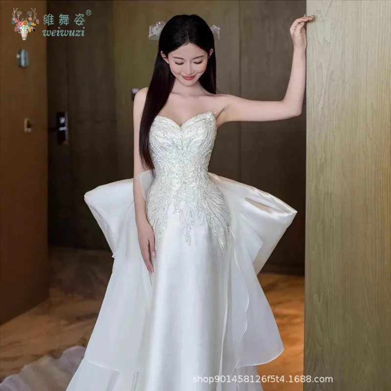 2025 nuevo vestido de novia de satén de estilo francés, vestido de novia de cola grande con lazo bordado de cuentas hecho a mano exquisito sin tirantes a la moda