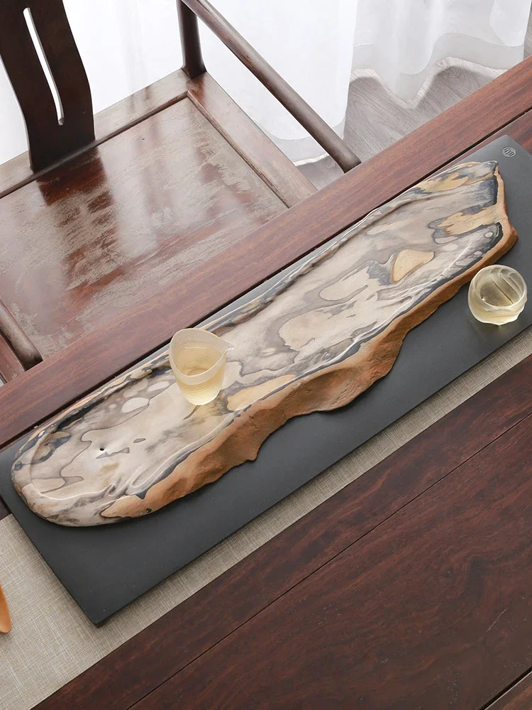 

Whole natural wood fossil tea tray, home tea sea, light luxury, modern black gold stone base, office tea table
