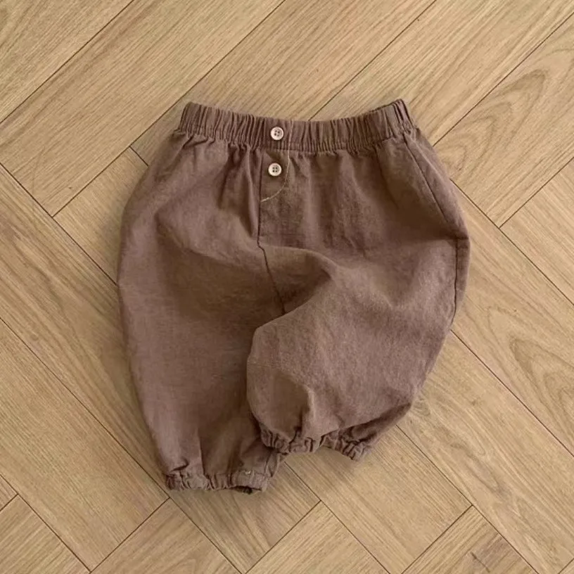 Pantaloni per bambini ragazzi coreani ragazze bambino traspirante tinta unita Versatile morbido Comfort elastico in vita 2024 bottone moda sciolto