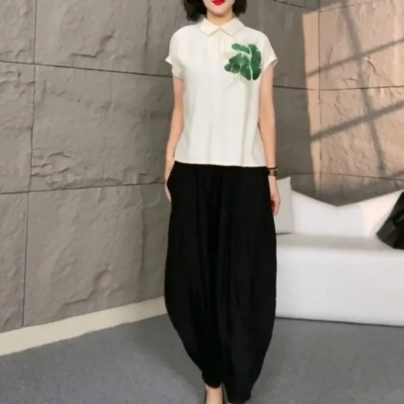 2025 Stampa femminile Top Pantalons Abito a due pezzi Pantaloni moda donna coreana Pantaloni lanterna manica corta da donna estiva 2 pezzi