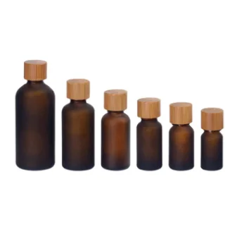 

Custom wholesale 10ml amber frosted round essential oil glass dropper bottle with bamboo cap