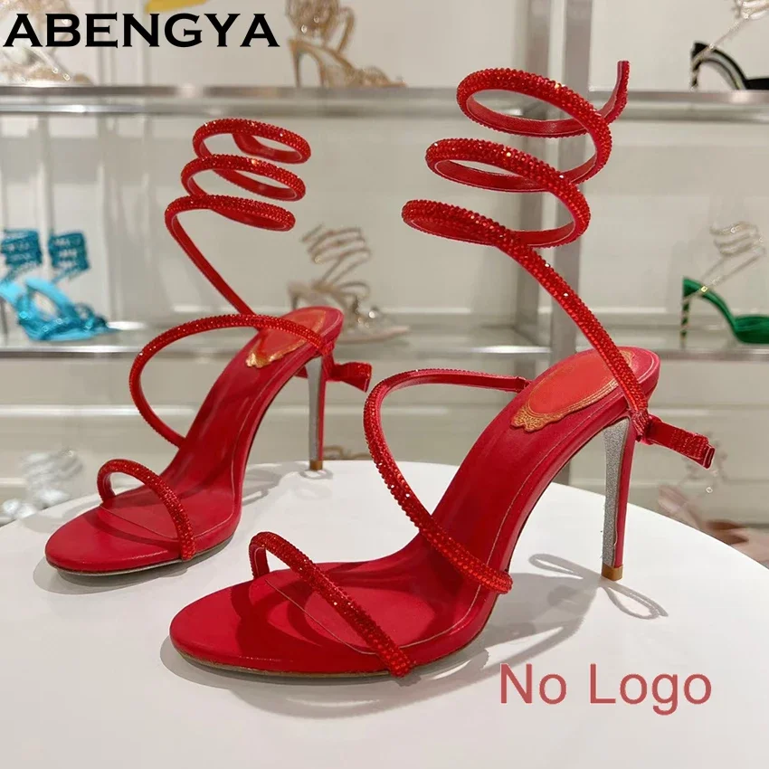 

Летние сандалии с кристаллами на тонком каблуке, женские блестящие сандалии со стразами и бантом, змеиный ремешок на щиколотке, вечерние туфли для женщин, сандалии-гладиаторы