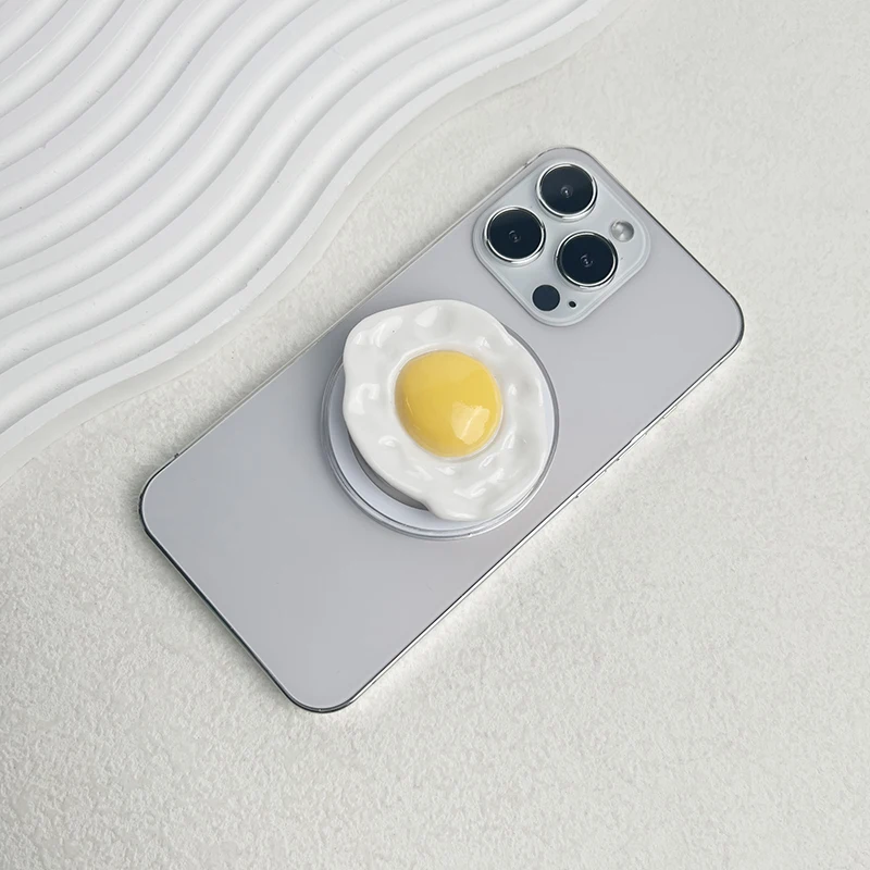 Kreatywny uchwyt na telefon w kształcie jajka z MagSafe, składany uchwyt z mocowaniem na telefon, uchwyt na palec z pierścieniem do iPhone'a i Samsunga, bezpieczny, rozkładany stojak.