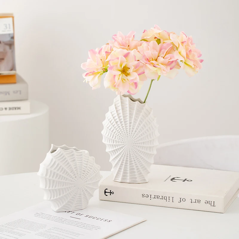 

Simple white ceramic vase - an elegant and luxurious decorative item for the living room, featuring a design with a sense of hig