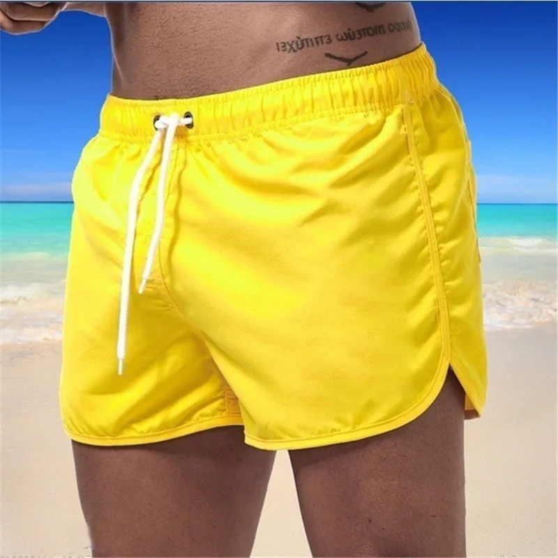 Pantalones de playa para hombre, shorts deportivos de secado rápido, de tubo de color sólido, holgados, con cordón, 3 minutos, novedad de verano