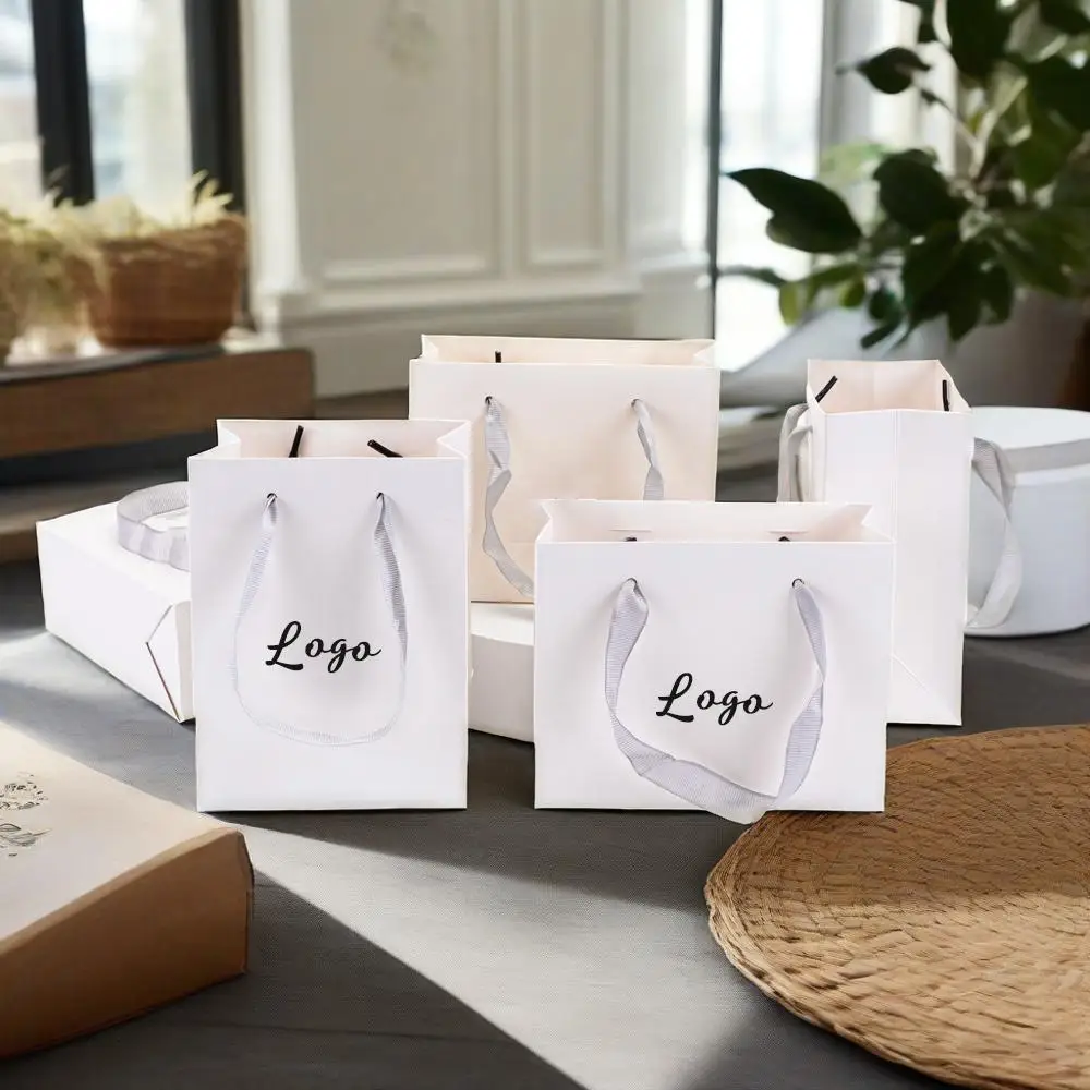 

Customed Logo White Boutique Shopping Wedding Party Paper Tote With Grey Handles Pouches Cloth Cosmetic Perfume Makeup Packaging