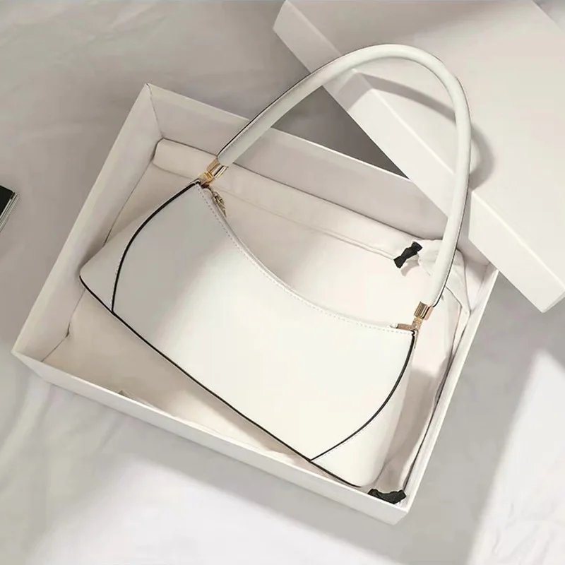 Tas Tangan Kulit Asli Retro Fashion Tahun Baru dan Musim Panas 2025 Wanita Multifungsi Pakaian Solid Gaya Korea Bantalan Stik Kopling B