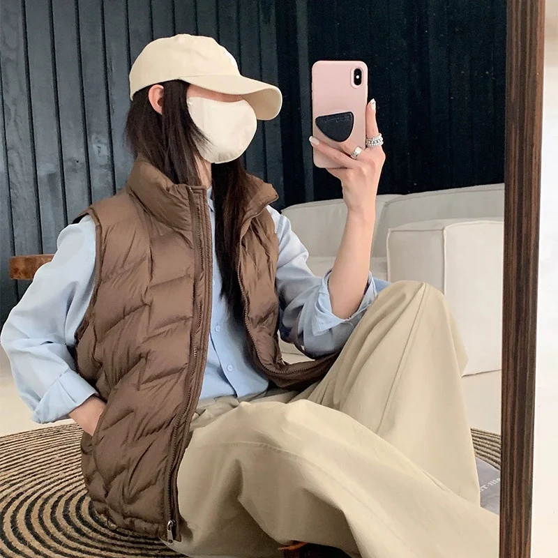 Women Fashion Autumn New 2025 Stand Collar Elegant Down Coats Warm Outerwear Casual Belt Sleeveless Winter Women Vests Jackets