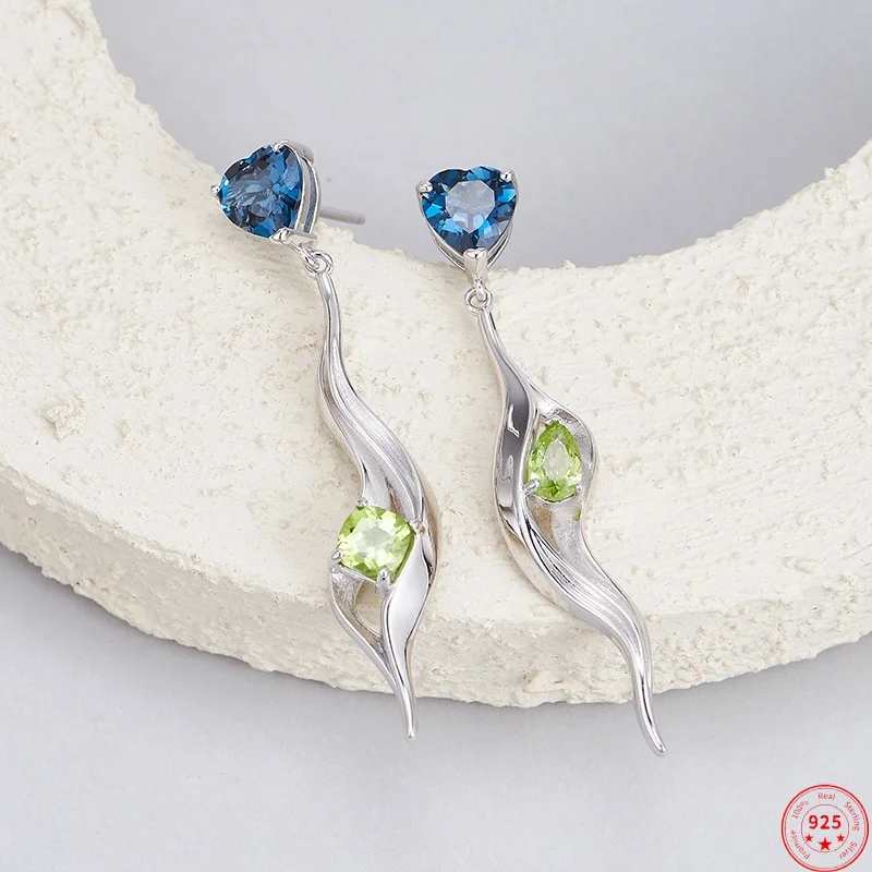 

Серьги-гвоздики из стерлингового серебра 925 пробы для женщин, несимметричный геометрический узор, инкрустация топазом, оливином, серьги-гвоздики, ювелирные изделия, оптовая продажа