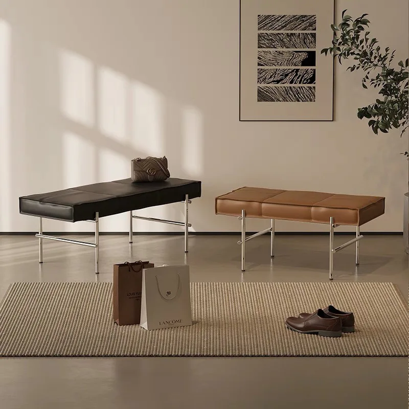 

At door, household enters house, changes shoes, wears shoes, and enters door with a stool.