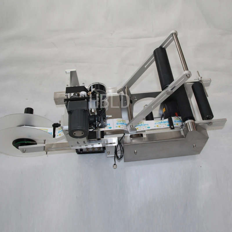 

Автоматическая машина для нанесения самоклеящихся этикеток на круглые бутылки (для вина, воды, парфюмерии)