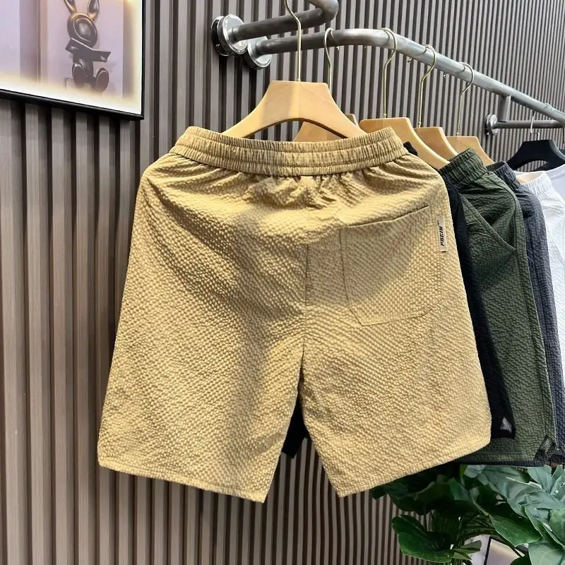 Pantalones cortos con bolsillos para hombre, pantalones cortos de playa de tablero blanco, diseñador de ofertas calientes, novedad en estilo coreano