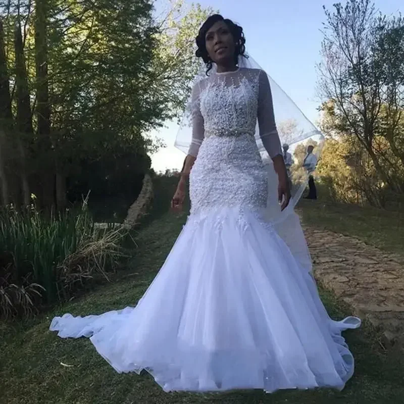 カスタマイズされたウェディングドレス高級ヘビービーズ長袖マーメイドシアーネックホワイトチュールナイジェリアアフリカ女性ブライダルガウン