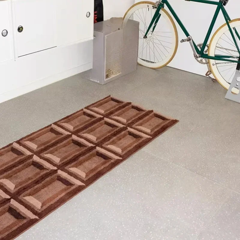Cute chocolate on the floor, thick carpet by the bed in the bedroom