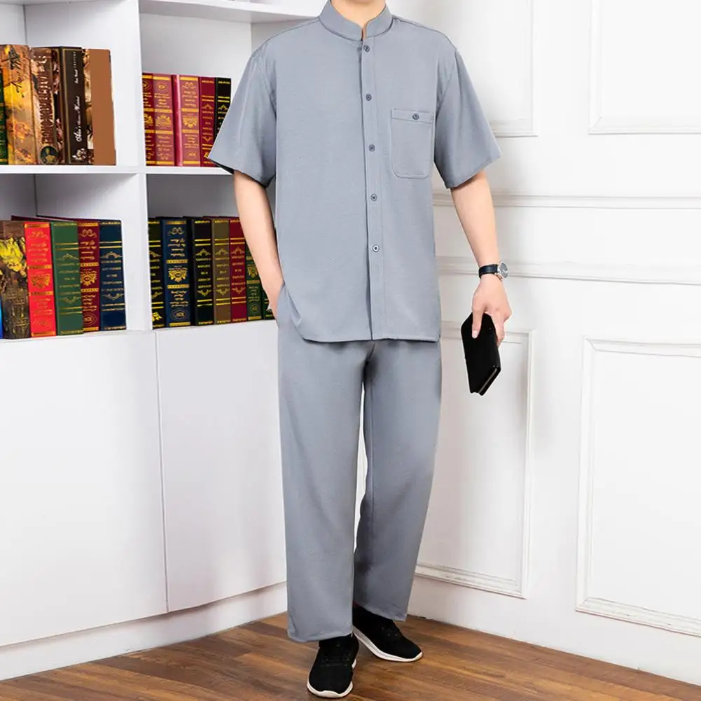 Conjunto de 2 unidades de traje para hombre con cuello levantado, camisa de manga corta con una botonadura, pantalones largos con cintura elástica, conjunto de Color sólido, corte holgado, ocio