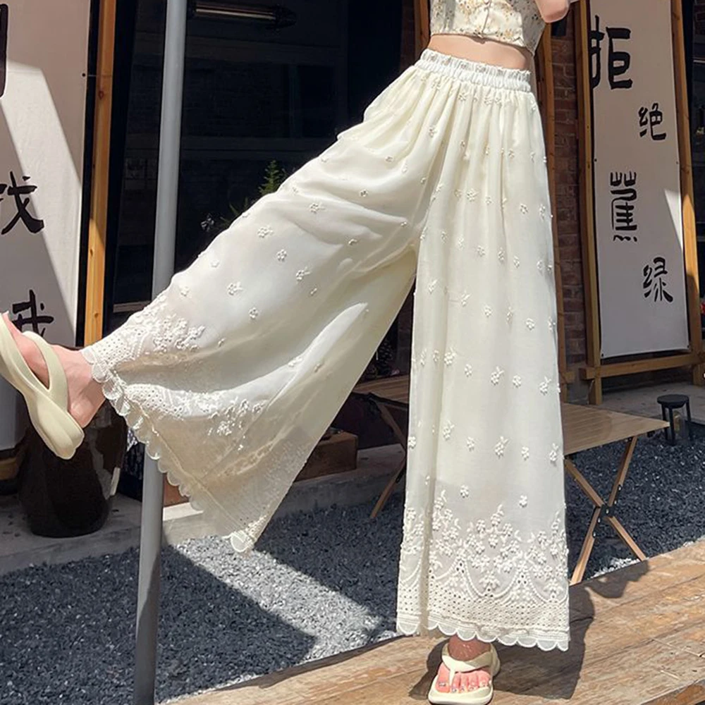 กางเกงลำลองขาบานเอวสูงผ้าบางขอบระบายแต่งลายปักสีขาวเอวยางยืดแบบบาง