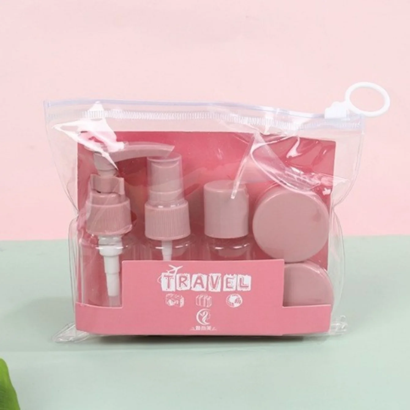 Six-piece travel toiletry bottle set with clear zipper bag