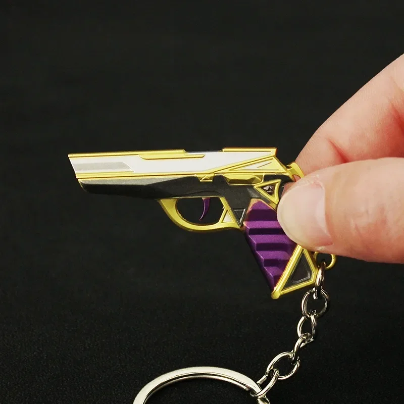 Mini llavero modelo de juguete de pistola púrpura y dorada de 5cm para colección, una mini pistola de juguete muy buena con llavero, accesorios Airsoft