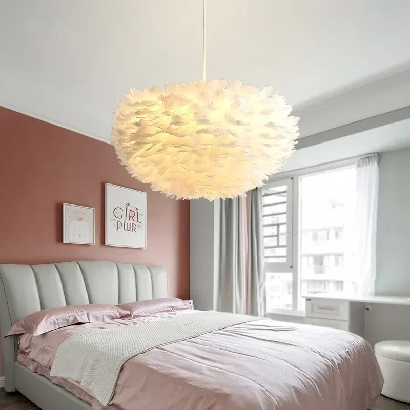 

Nordic minimalist warm and romantic creative trendy girl's bedroom with a white feather lamp on the bedside
