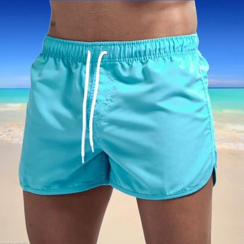 Shorts esportivos de surf na praia masculino, calça casual fitness, tamanho grande, três quartos, verão, 2024