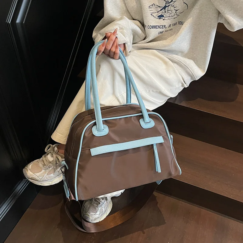 

2025 Summer New Waterproof Nylon Bag Women Niche Travel Commuter Crossbody Handheld Fashion Purse