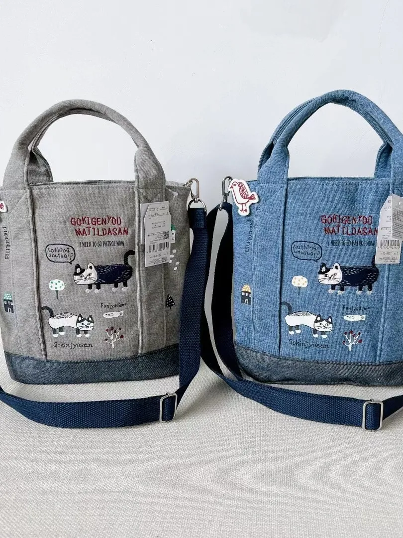 

Kusuguru Embroidered Health Canvas Shoulder Bag Handheld Crossbody Bag Multiuse Commuting Bag Fashionable Youth Satchel
