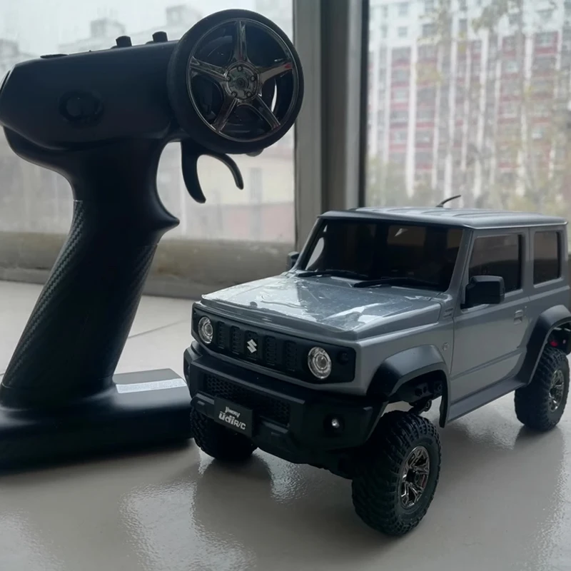 新しい Udirc 1/18 Ucx2402 ジムニー Rc カーオフロード 4x4 Rc クローラーとリバースギアボックスシミュレーションモデルクライミングカー Rtr グリーンブルー