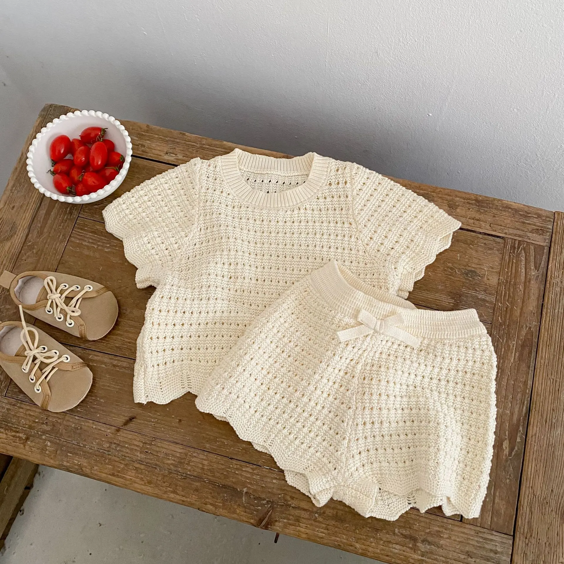 Trendy summer casual round neck knitted irregular short sleeved top paired with bow shorts two-piece set for children
