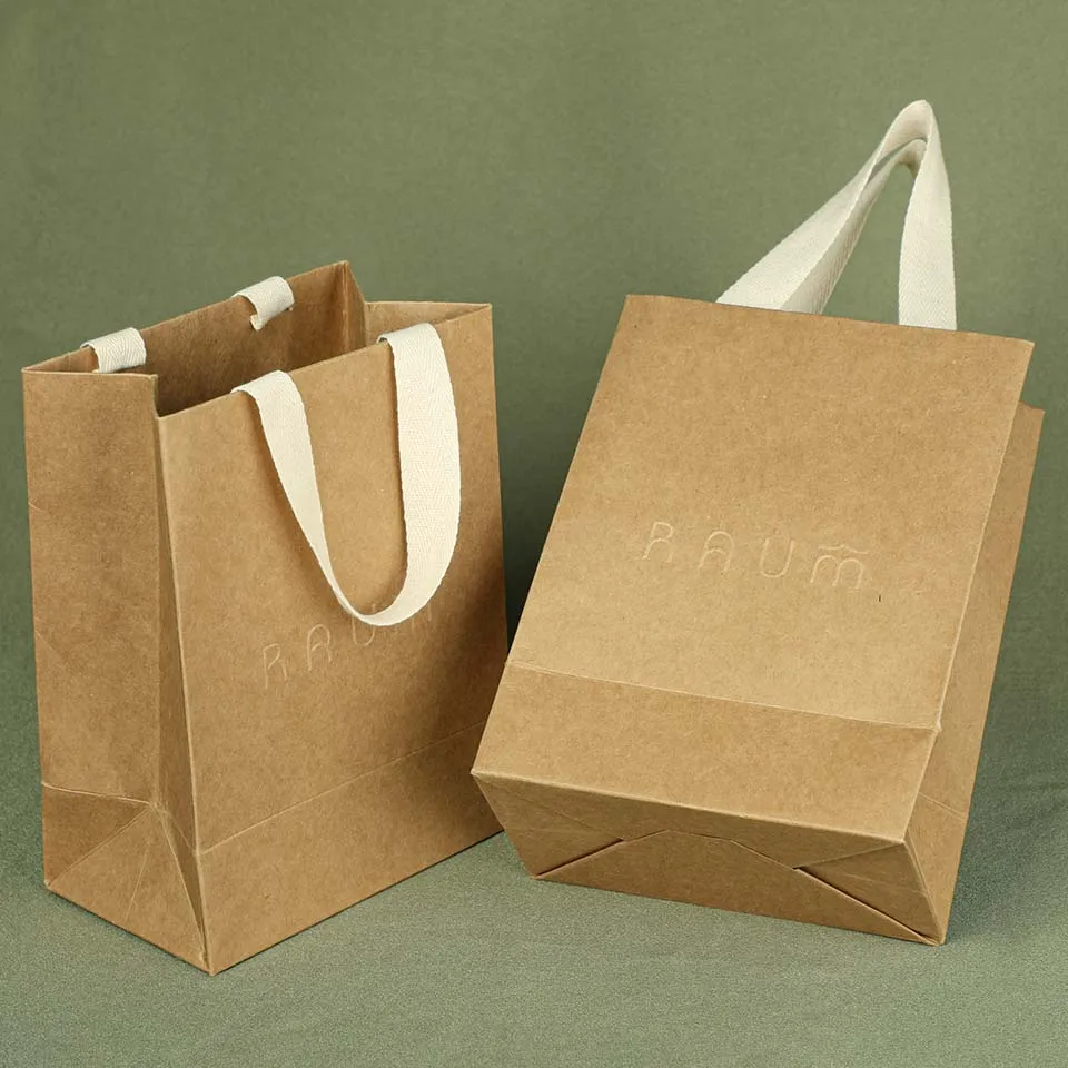 Custom  Kraft Paper Shopping Clothing Gift Bag Luxury Handle mini packaging Printed Paper Bags with embossed logo