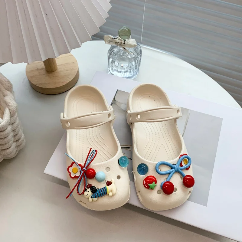 

A pair of children's Mary Jane clogs with cute charms adjustable strap non-slip sole for daily home use MM-692