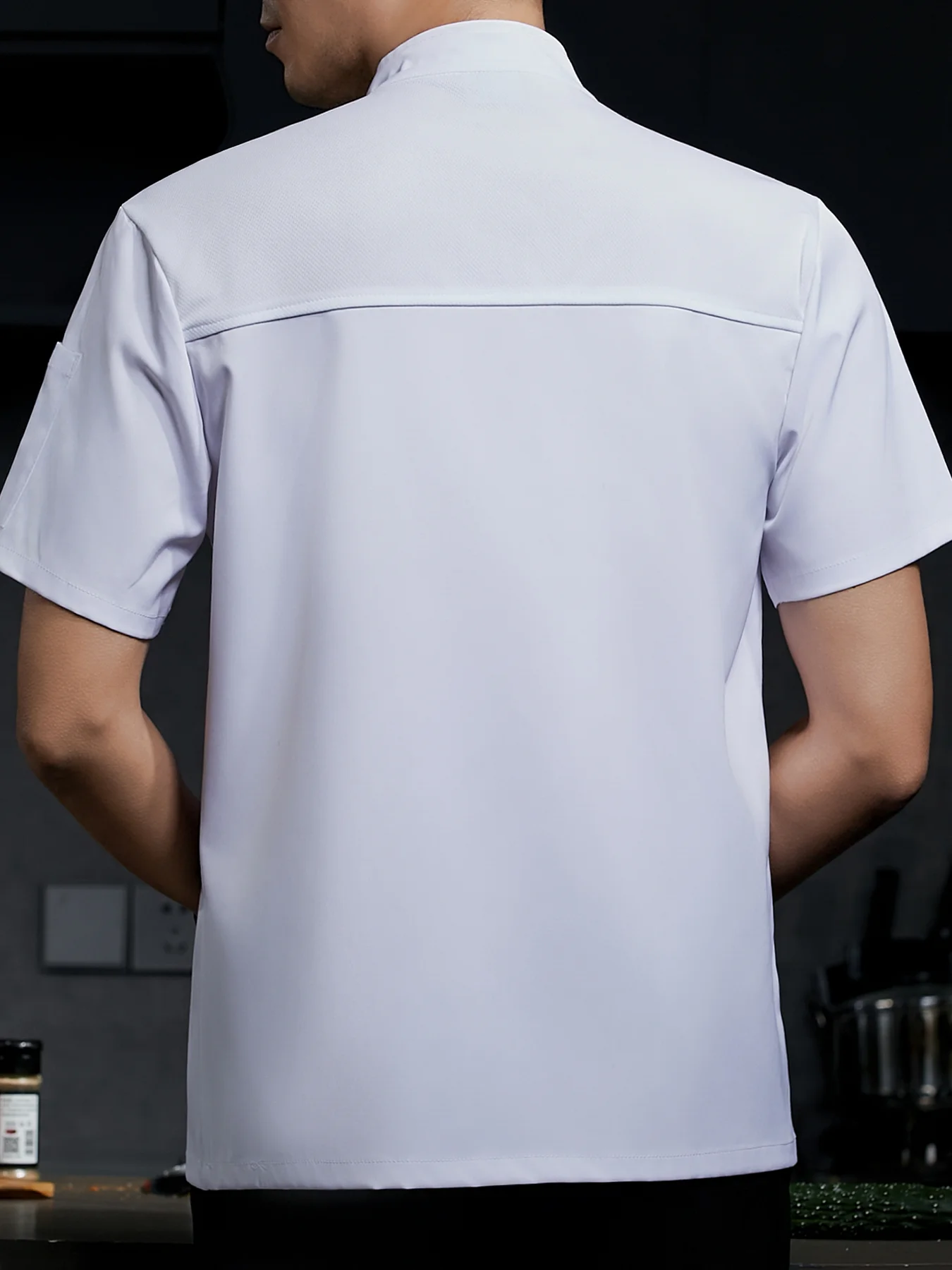 Short-sleeved chef uniform with a breathable stand-up collar and pockets, unisex, suitable for restaurants and hotels.