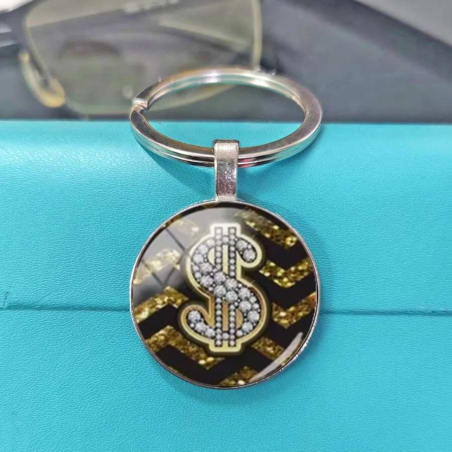 Graffiti style dollar symbol design with different styles of keychains, circular glass alloy, street hip-hop style