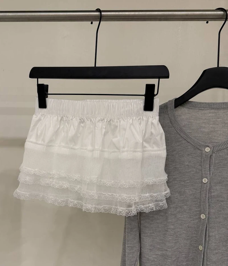 Falda de media capa con ribete de encaje INS, ropa de capas blancas a la moda para mujer, falda corta envolvente de corte a de Lolita dulce para primavera, ropa de calle