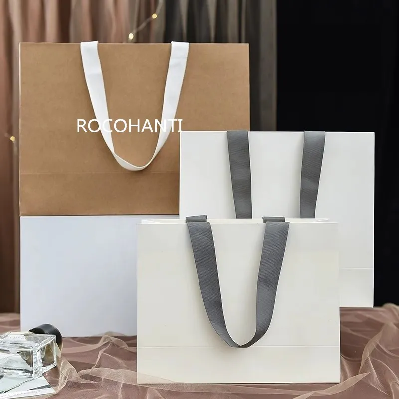 Customized high-grade luxury shopping gift paper bag with ribbon handle grey white large paper bag for boutique clothes store