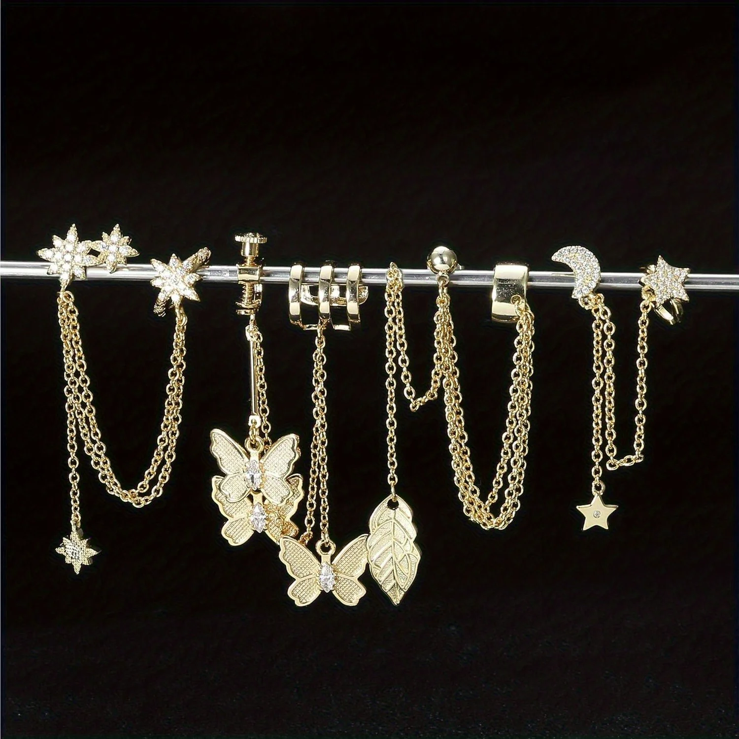 

Drperfect 4PCS Moon Star Cuff Earring Chain for Women Leaf Ear Studs Butterfly Wrap Clip on Earring Dangling Chain Earrings