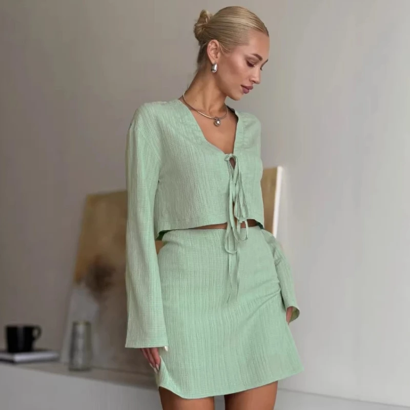 

2025 Summer Hot Selling New Thin V-neck Long Sleeved Lace up Top and Half Skirt Two-piece Set for Women