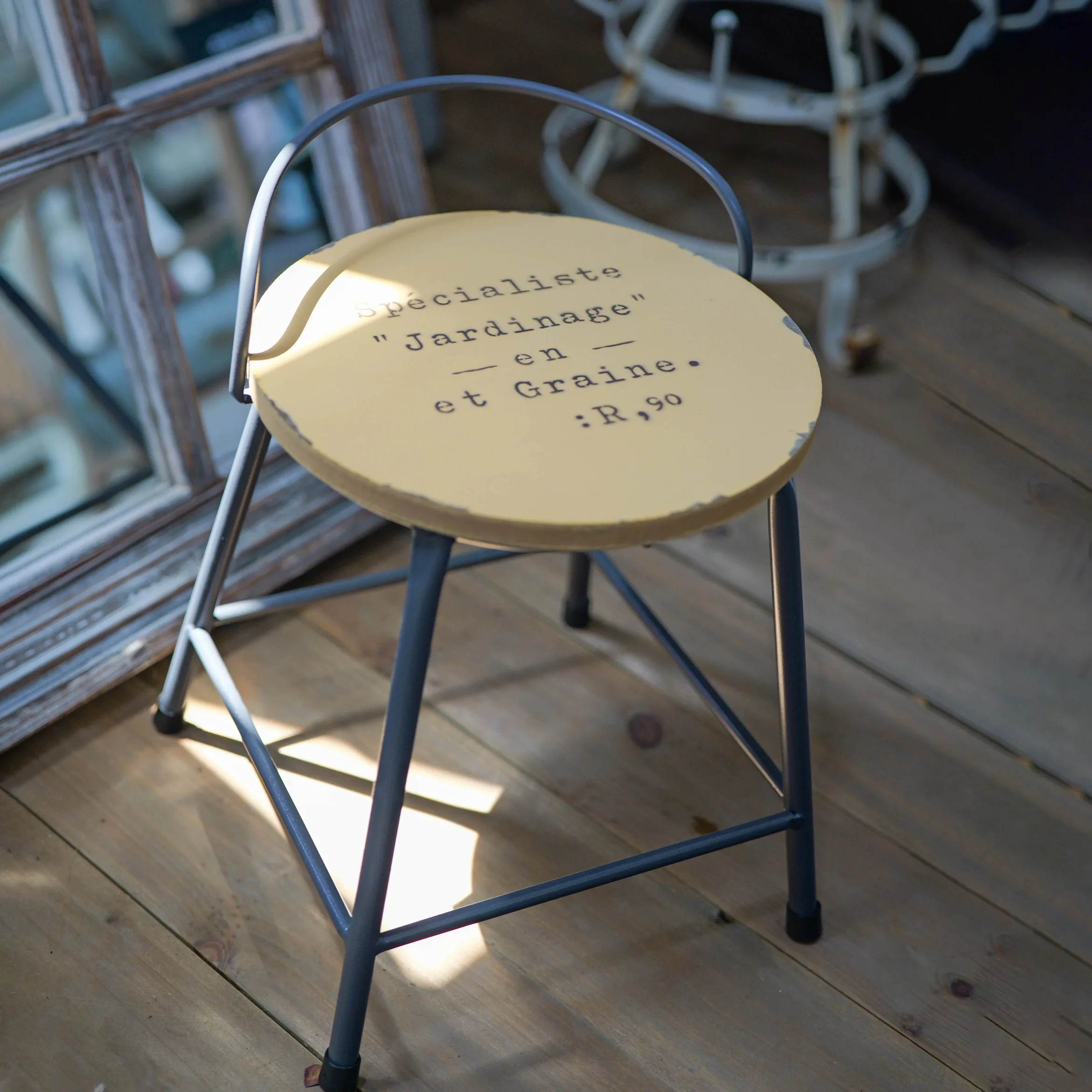 

Vintage Round Metal Stool Plant Stand, Cream with French Typography, Iron Frame, 9.8 Inch Diameter, 14 Inch Height