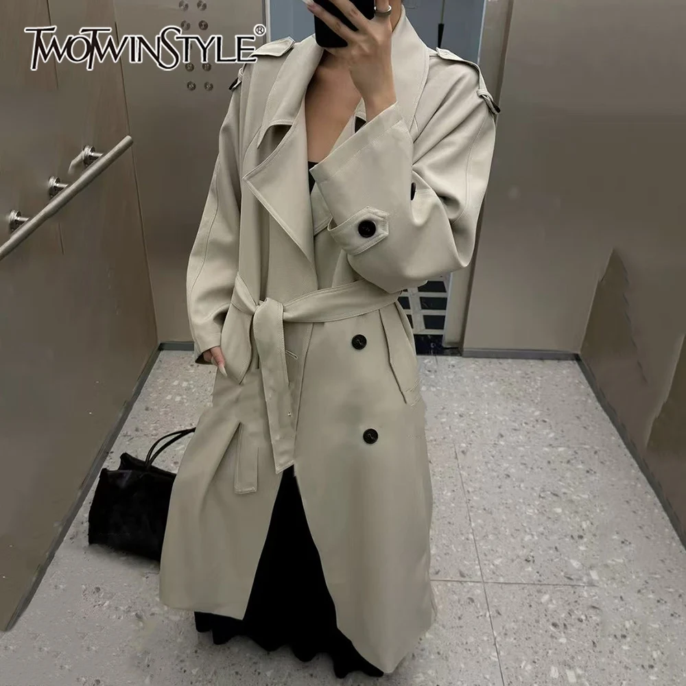 

TWOTWINSTYLE Solid Spliced Bandage Chic Trench Female Lapel Long Sleeve Minimalist High End Women's Trenchs Autumn Fashion New