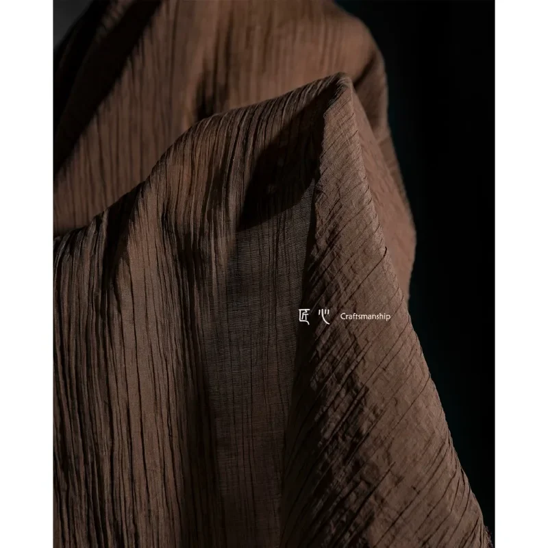 Dark brown ravine rayon cotton fabric with soft texture, draped and pleated bottom, shirt skirt, clothing designer fabric