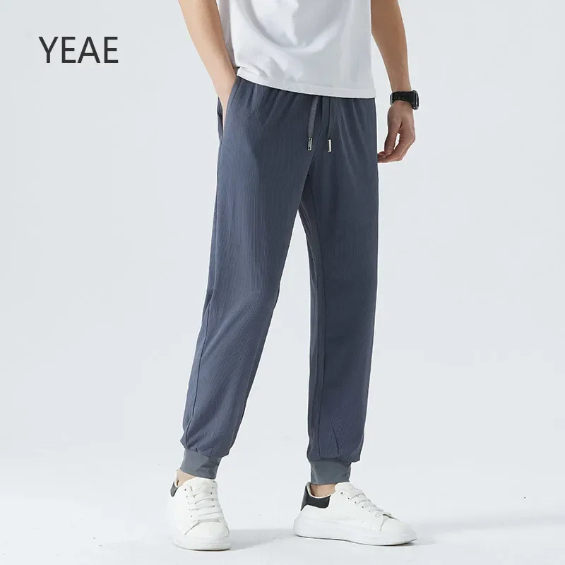 

Slim Elastic Waist Men's Ice Silk Pants Spring and Summer 2025 New Breathable and Dry Knitted Embossed Checkerboard Pockets