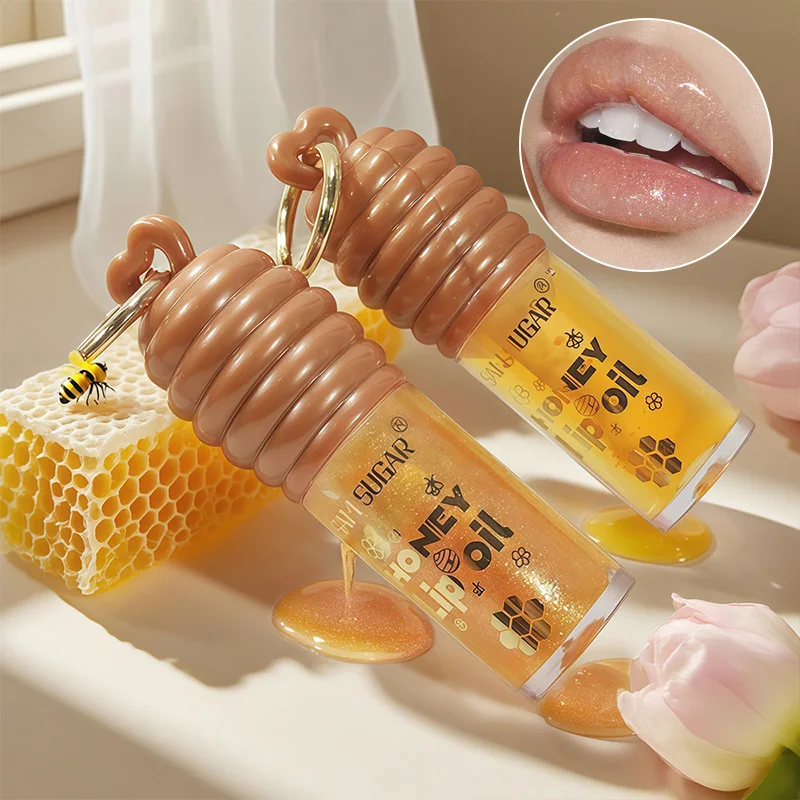 Sam Sugar Honey Lip Oil Deeply Moisturizes and Improves Lip Lines, Offering Both Lip Gloss and Lip Balm Functions, with a Transparent Texture That Gives a Refreshing Feel, Long-Lasting Hydration and Moisture-Locking Properties, Keeping Lips Moist and Plump at All Times, Suitable for Daily Lip Care and as a Primer before Applying Makeup, a Must-Have for Autumn and Winter.