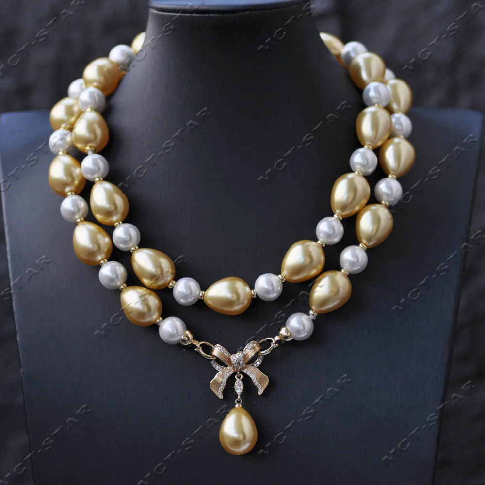 

Z14602 33" 18mm Golden Drop White Round Sunth Sea Shell Pearl Bowknot Necklace Pendant