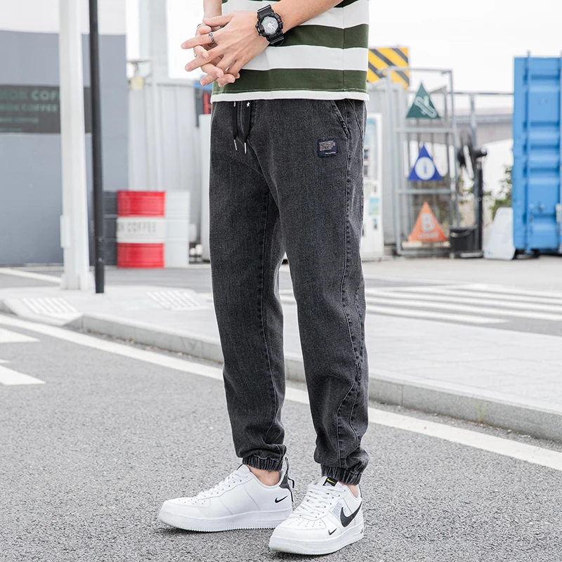 Nowe Duże Rozmiary 8XL Męskie Jeansy Jogger Streetwear Czarne Niebieskie Casualowe Spodnie Cargo Denimowe Elastyczne Bawełniane Spodnie Taper Jeansy Luźne Spodnie